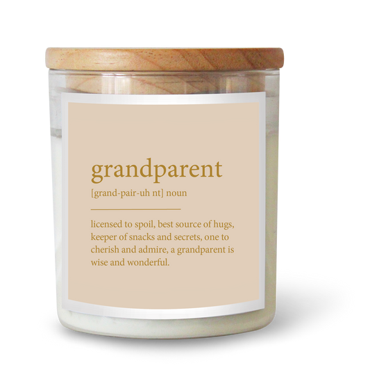 The Commonfolk scented white candle with a wooden lid and a label that reads 'grandparent' with its definition, all presented against a plain background.