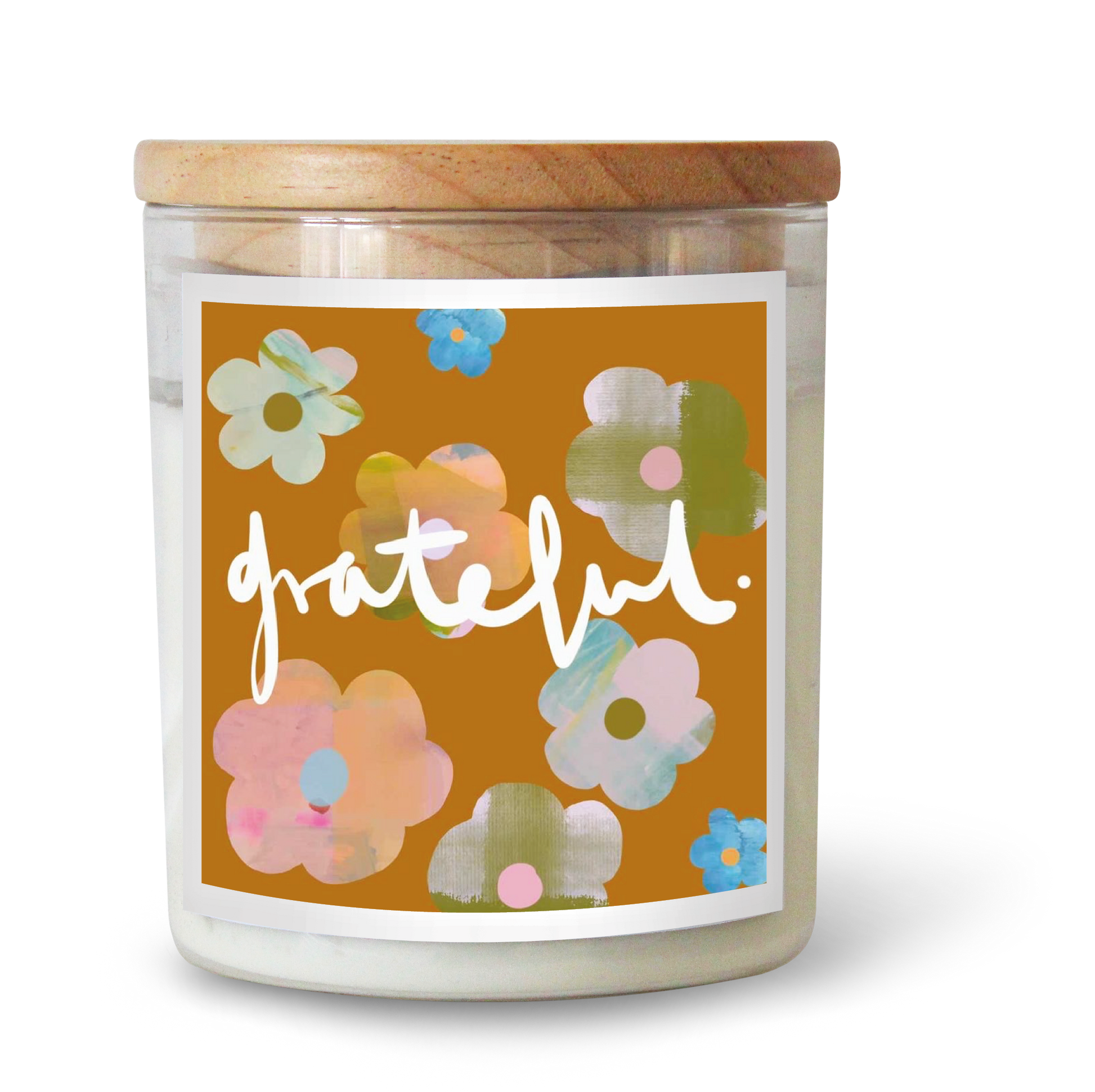 The Commonfolk scented candle features a floral design with various colors such as pink, blue, and green on a yellow background, with the word 'grateful' written across the center.