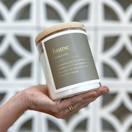 Home candle from The Commonfolk, featuring a simple design and warm glow, perfect for creating a cozy atmosphere.