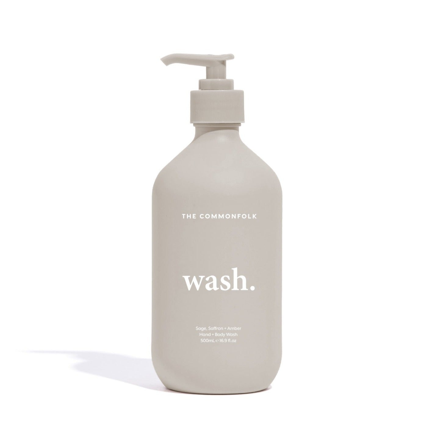The Commonfolk matte pumice 500ml bottle of hand and body wash with a pump dispenser, labeled 'wash.'