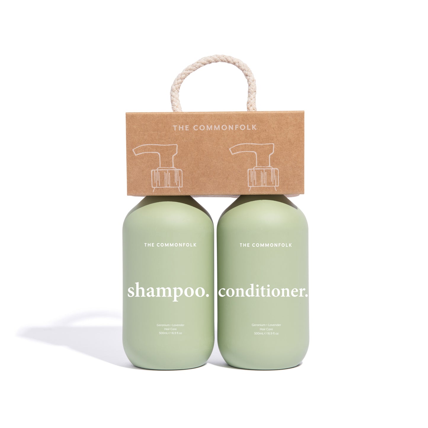 The Commonfolk shampoo and conditioner in matte sage green finish, 500ml bottles, packaged with a recycled Kraft carry caddy.