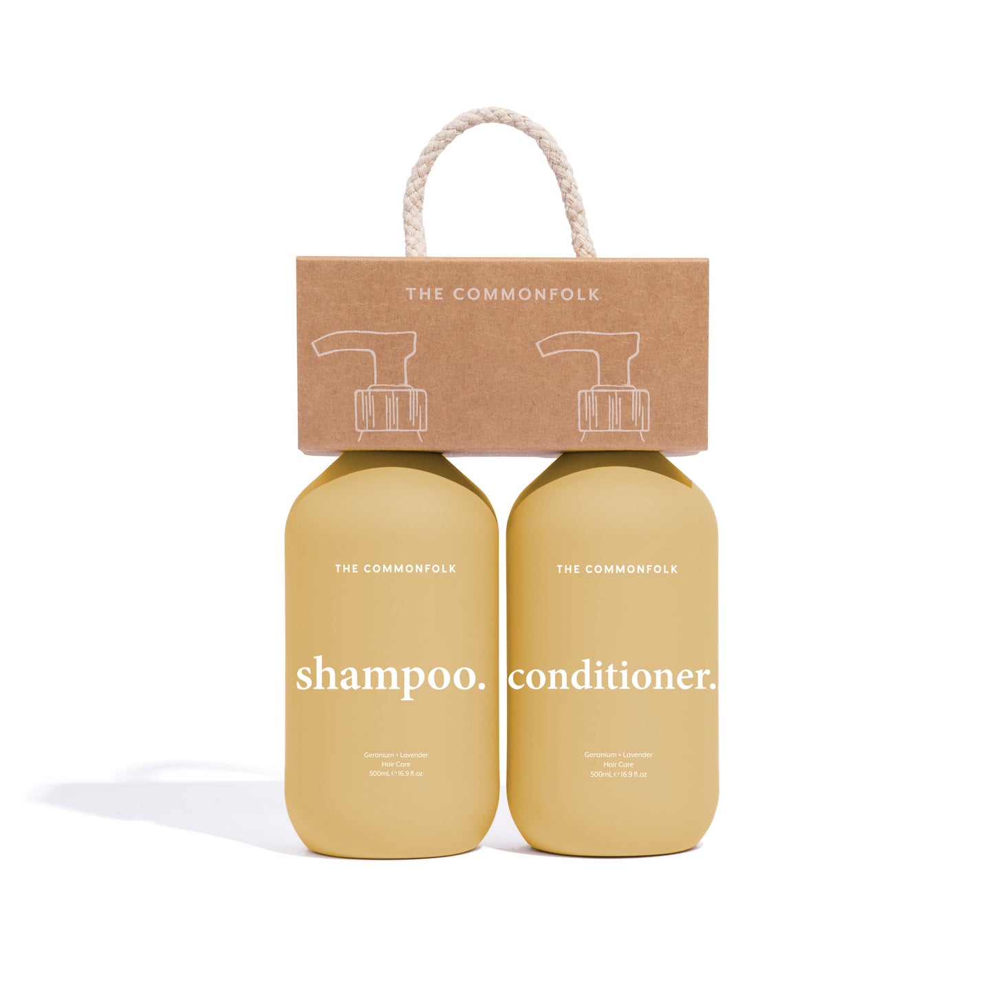 The Commonfolk two bottles of 500ml shampoo and conditioner with a yellow matte finish, packaged in a recycled Kraft carry caddy with a rope handle.