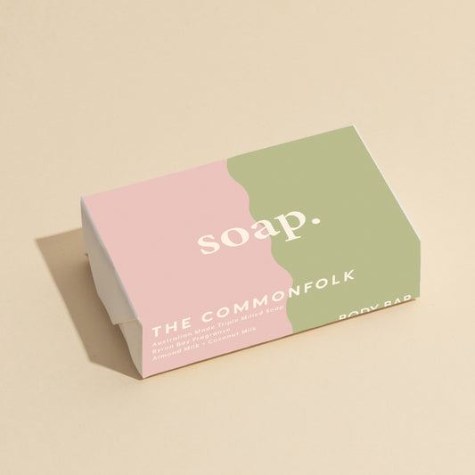 The Commonfolk 200g body bar soap with pink and sage color blocks, and the text 'soap' printed on it.