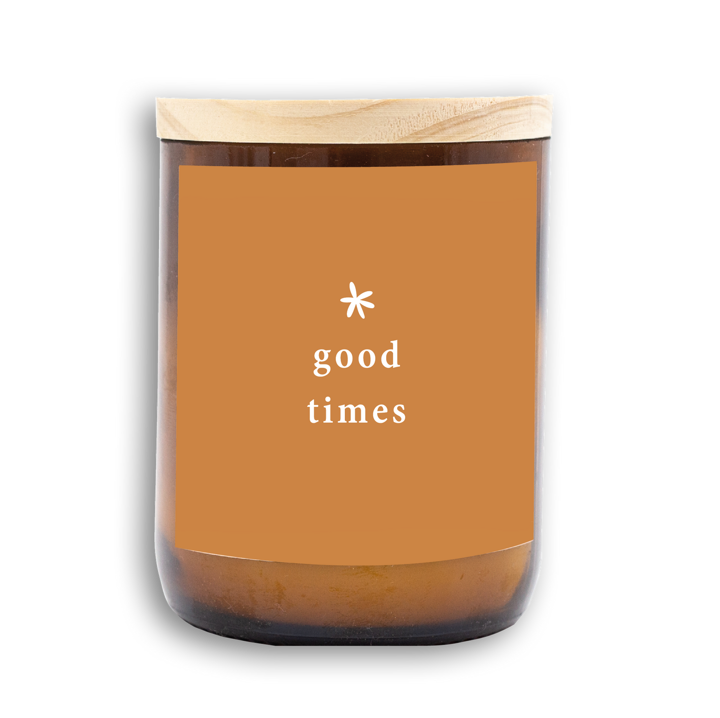 The Commonfolk scented candle with a wooden lid, amber glass body, and a label with the text 'good times' on it.