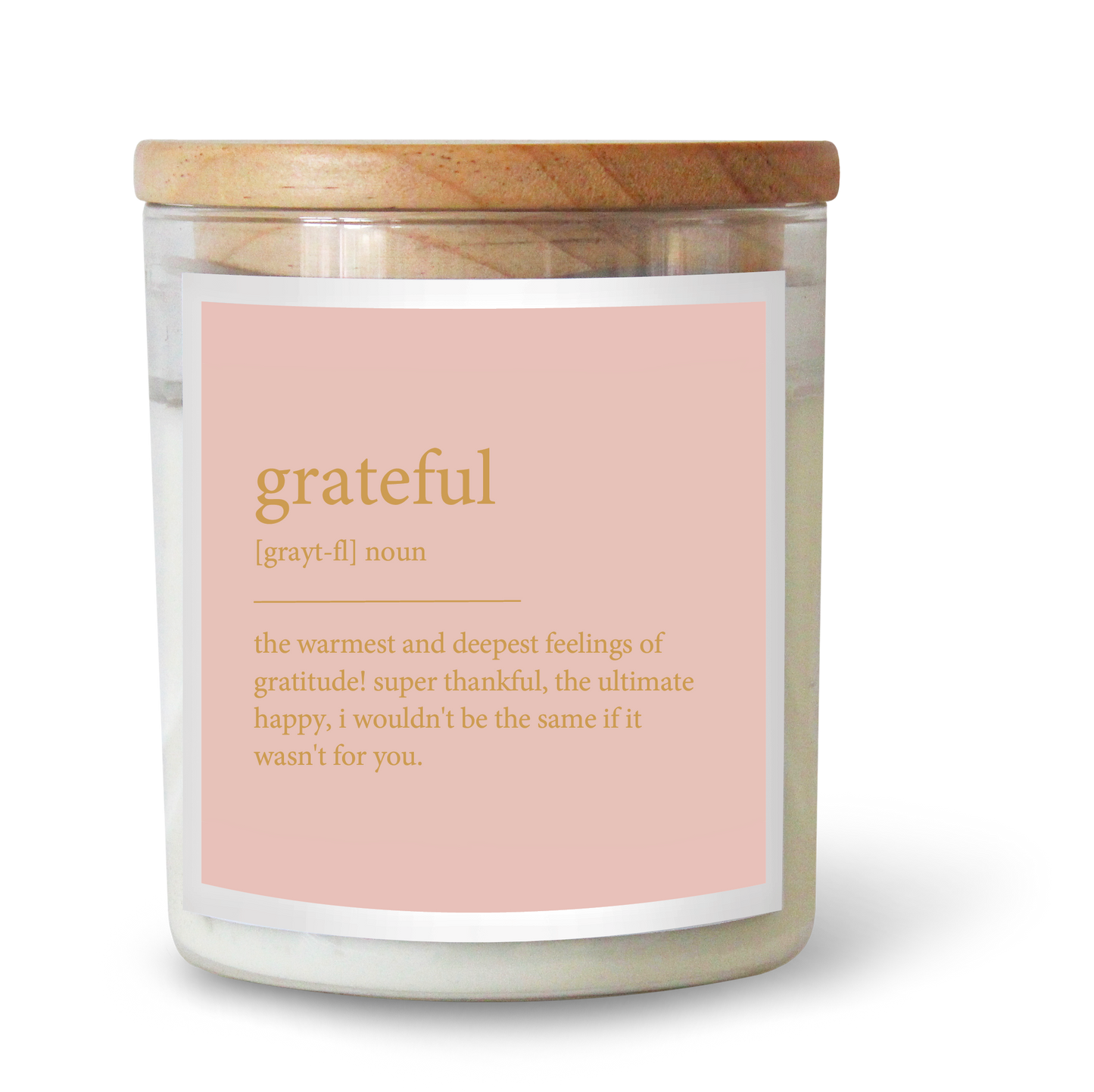 The Commonfolk scented white candle with a wooden lid and a label that reads 'grateful' alongside the definition 'the warmest and deepest feelings of gratitude'.