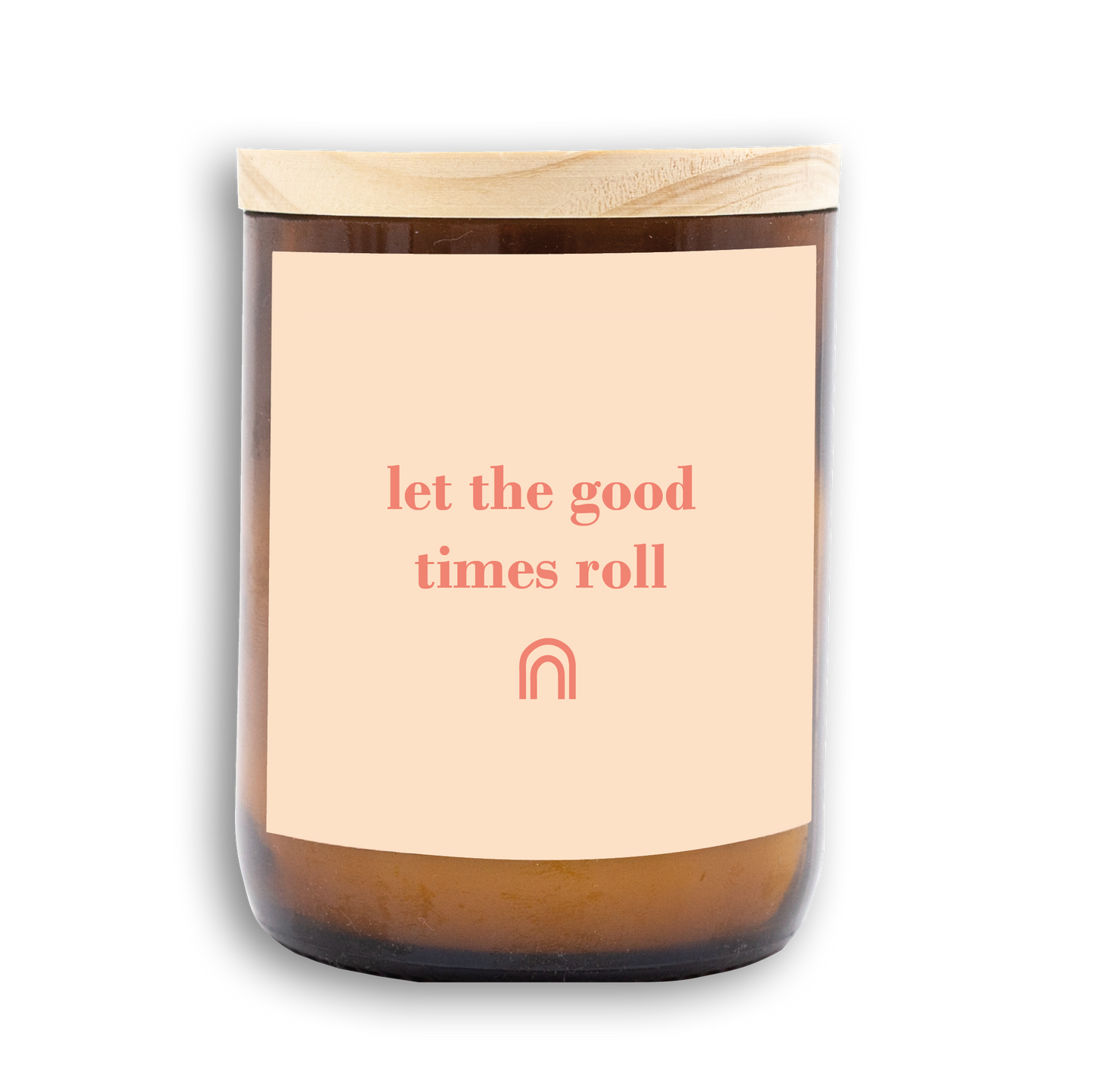 The Commonfolk scented candle has a beige label that reads 'let the good times roll' in pink lettering, with a wooden lid on top.