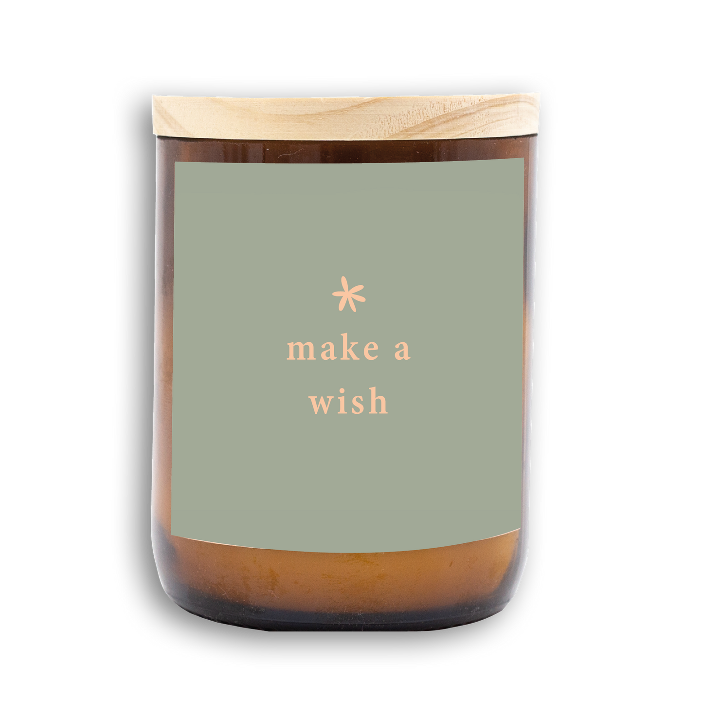 The Commonfolk scented candle has a label that reads 'make a wish' in a minimalist font, predominantly in a neutral color palette with a wooden lid.