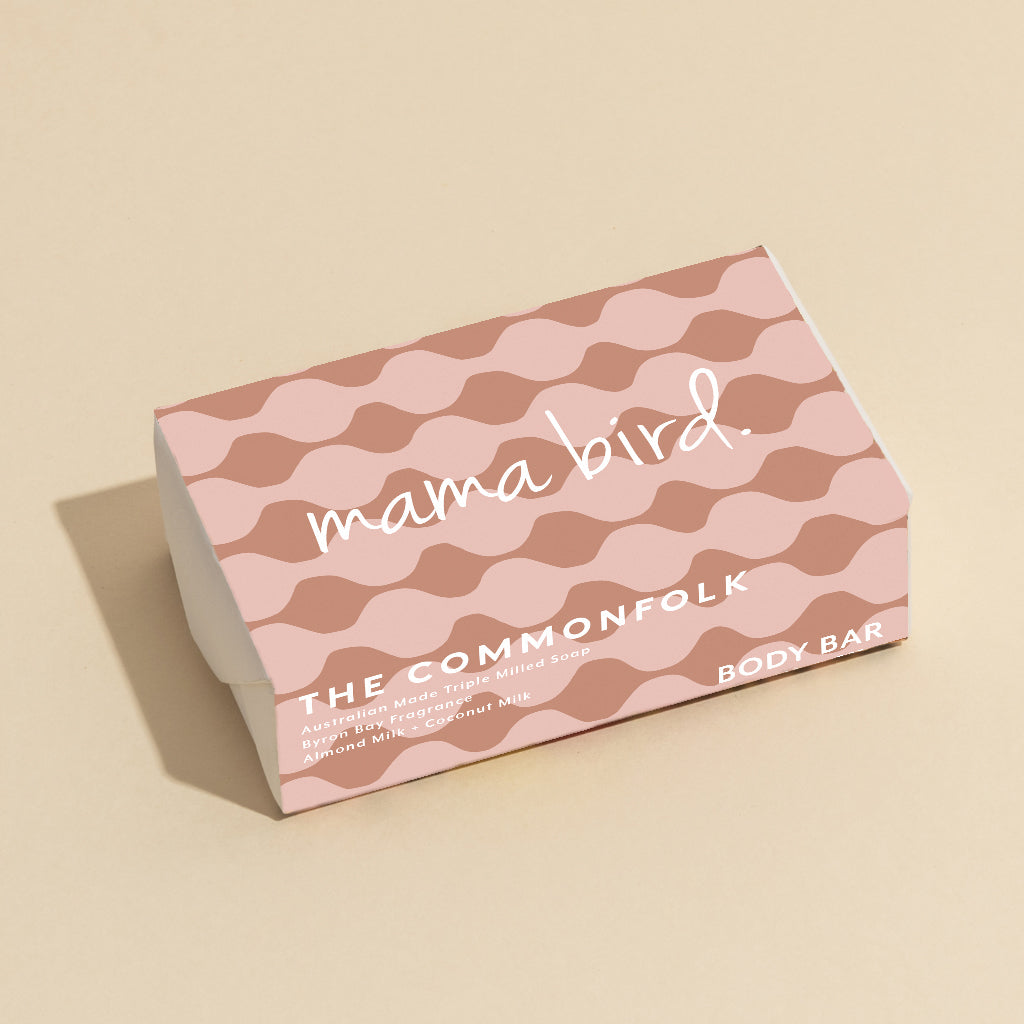 The Commonfolk 200g body bar soap with pink and white geometric patterns, labeled 'mama bird' on the top.