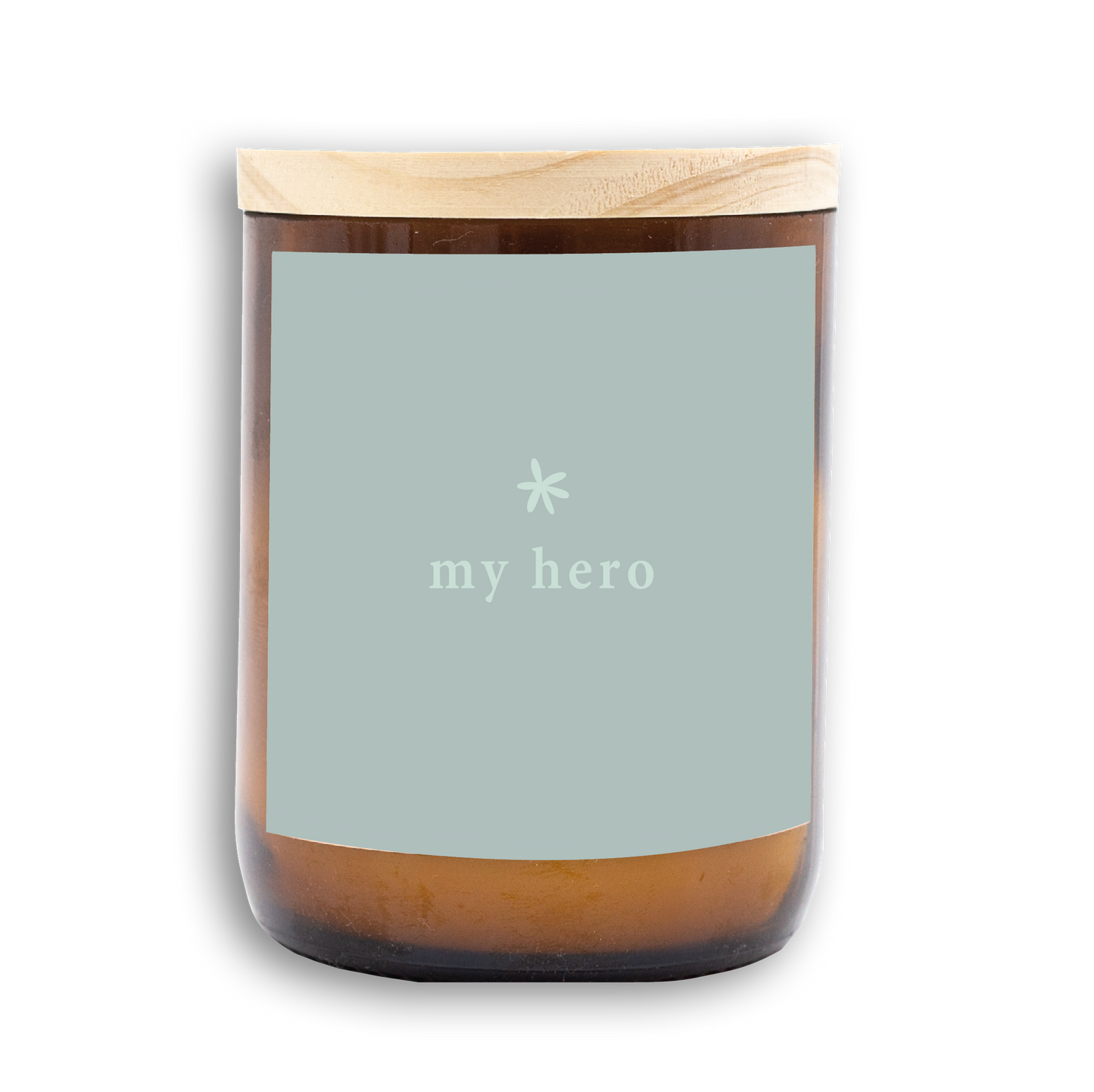 The Commonfolk scented candle has a label that reads 'my hero'. It features a wooden lid and an amber container with white wax.