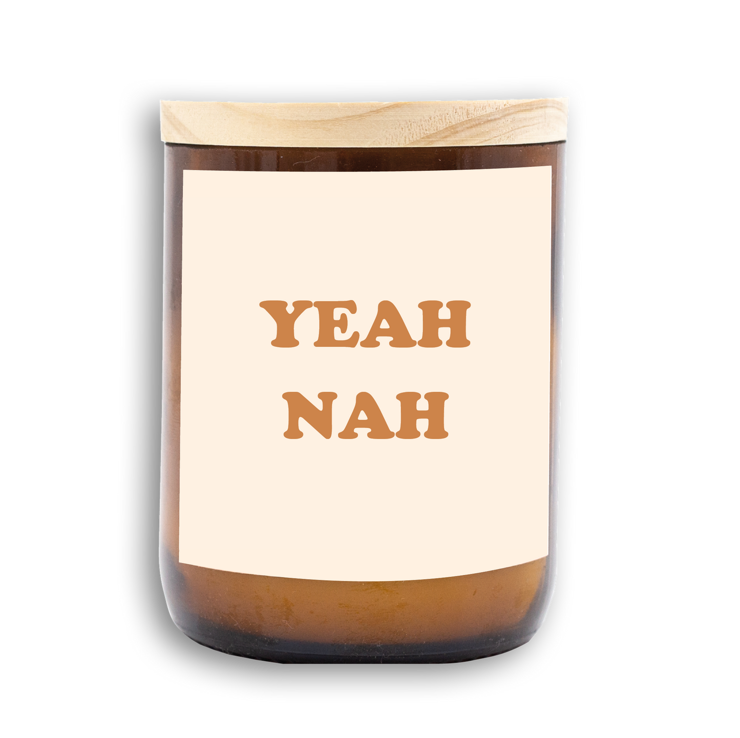 The Commonfolk scented candle has a label that reads 'YEAH NAH.' It is predominantly white with brown text and comes in an amber glass jar with a wooden lid.