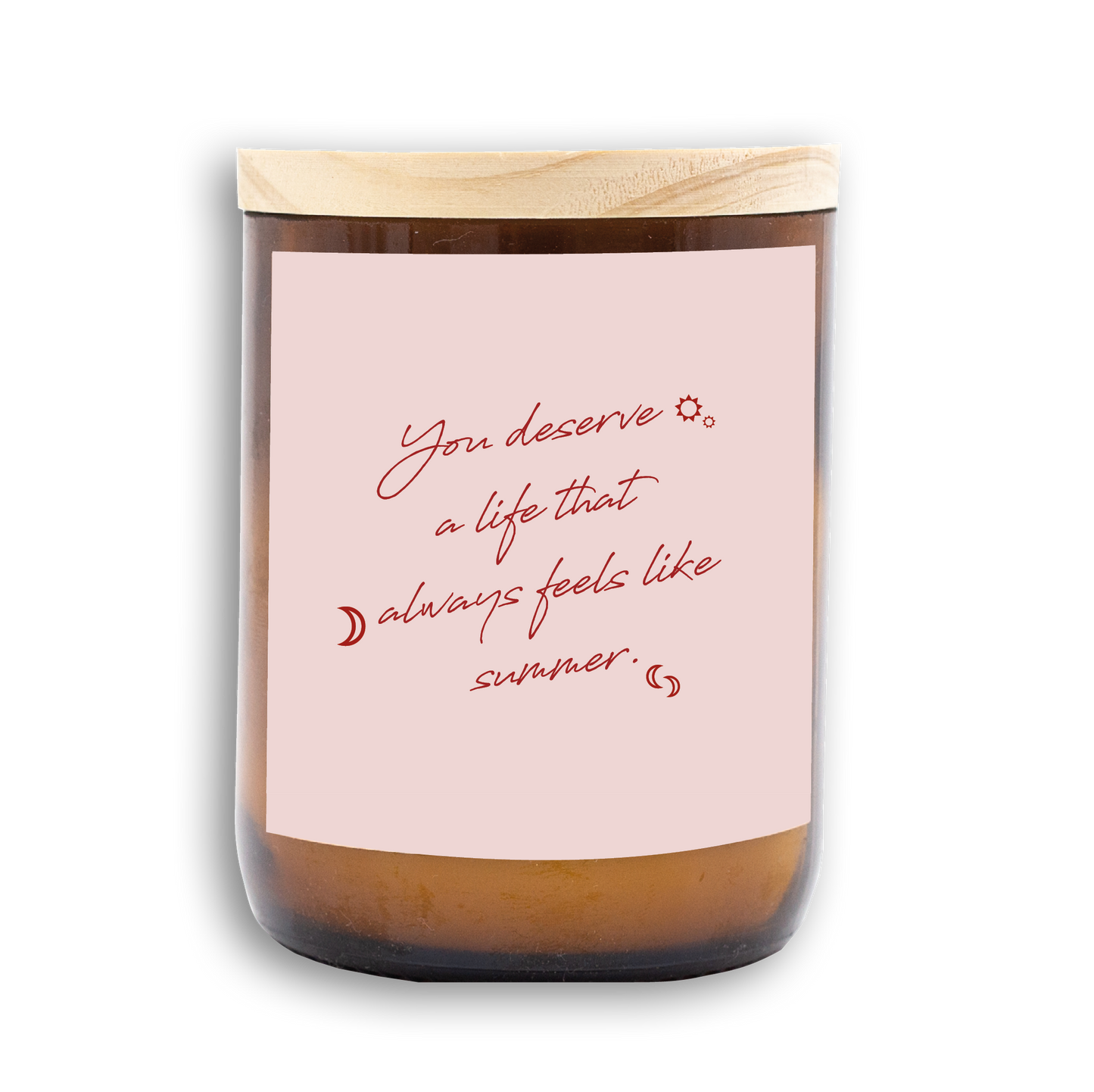The Commonfolk scented candle in an amber jar with a wooden lid and a label that reads, 'You deserve a life that always feels like summer.'