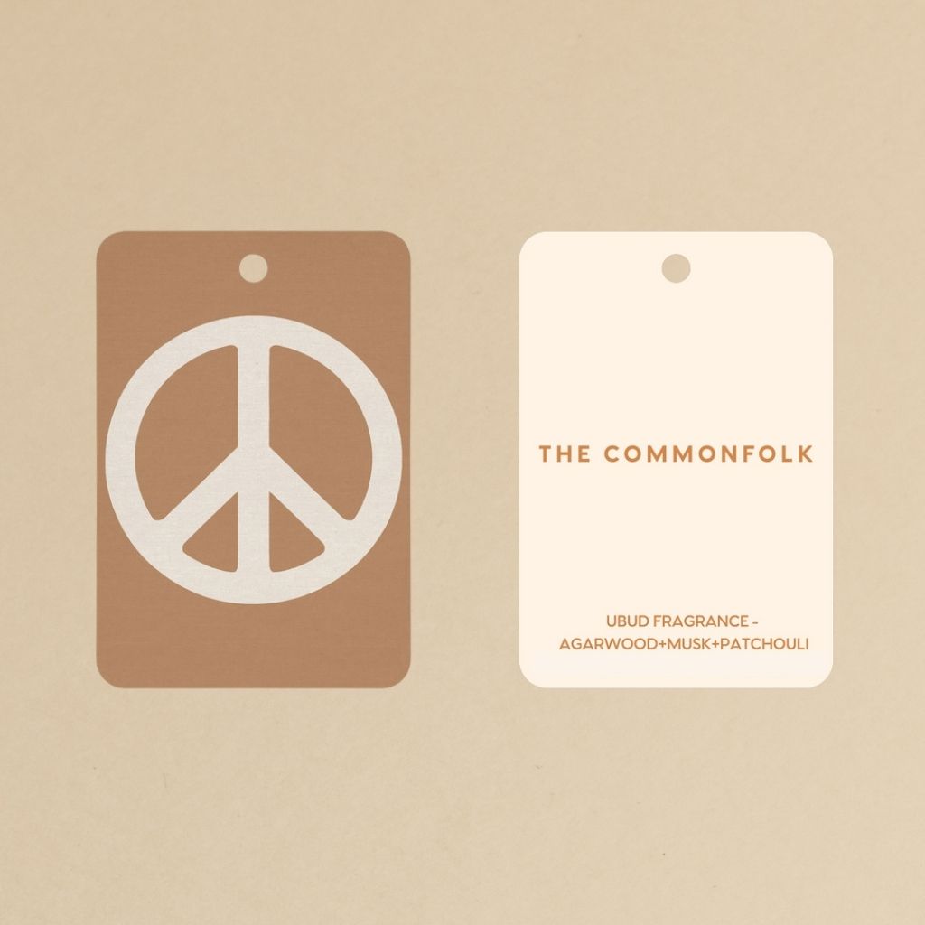 Peace sign air freshener displaying the front and back design.