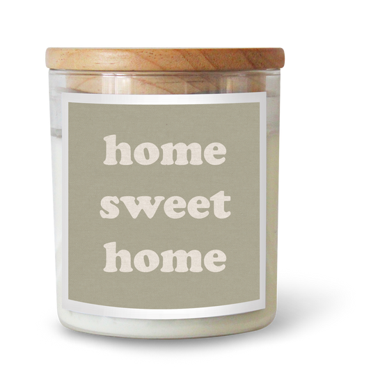 The Commonfolk scented candle has a label that reads 'home sweet home,' featuring a white wax candle in a clear jar with a wooden lid.