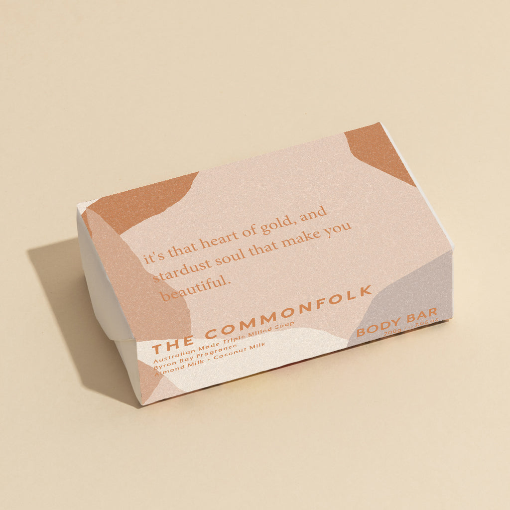 The Commonfolk 200g body bar soap with the text 'It's the heart of gold, and stardust soul that make you beautiful.' on the top.