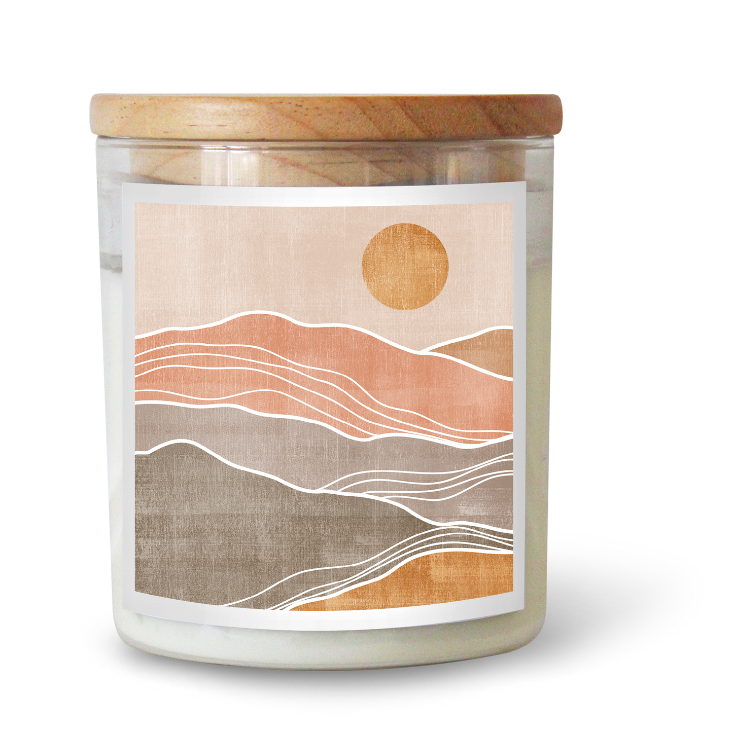 The Commonfolk scented candle features a label with a minimalist landscape of the sun and mountains in shades of cream, pink, and brown.