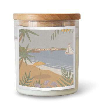 The Commonfolk scented candle with a beach scene label featuring palm trees and a sailboat.