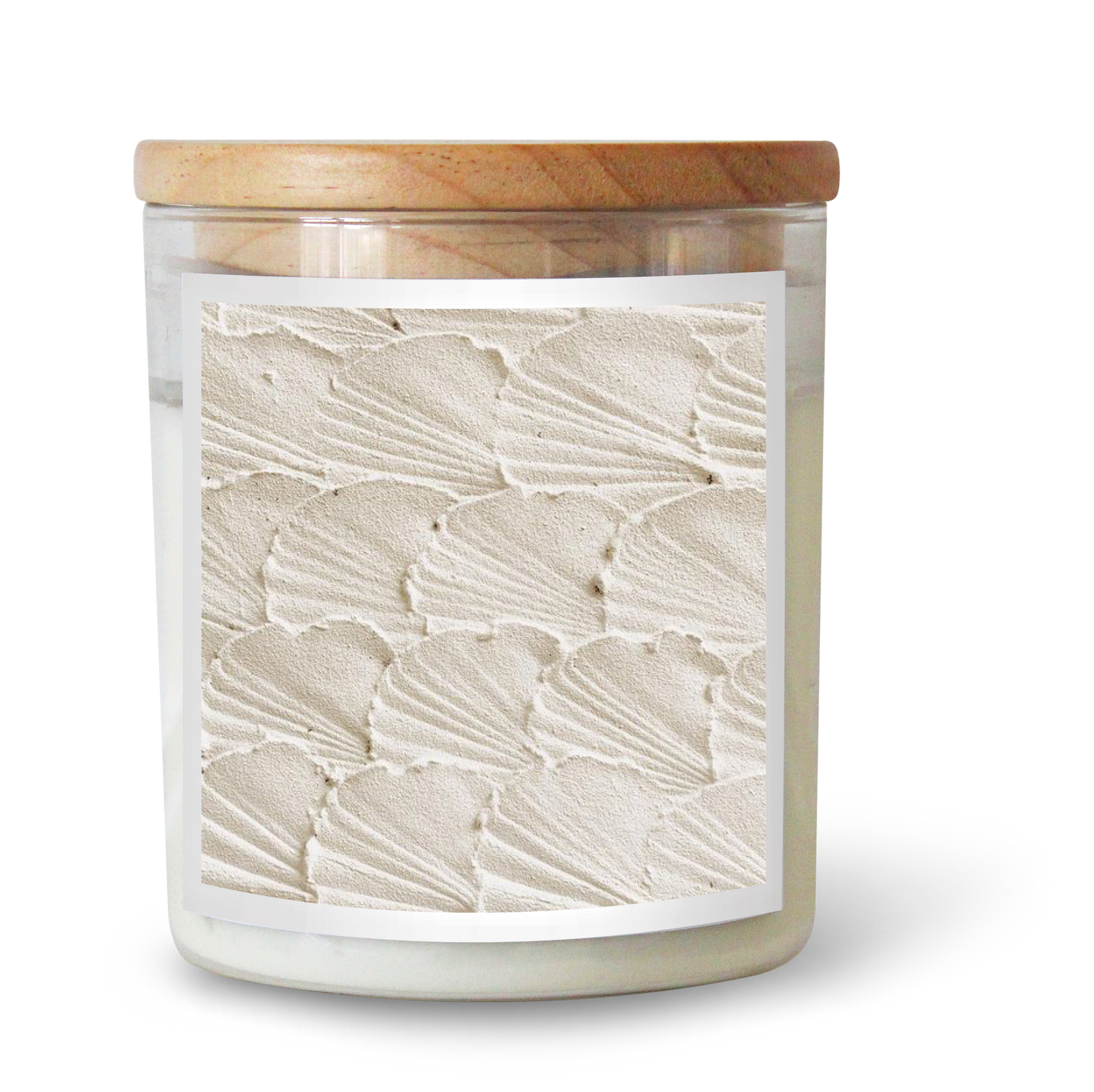 The Commonfolk scented candle features clear glass, white wax, a beige textured surface, and a wooden lid.