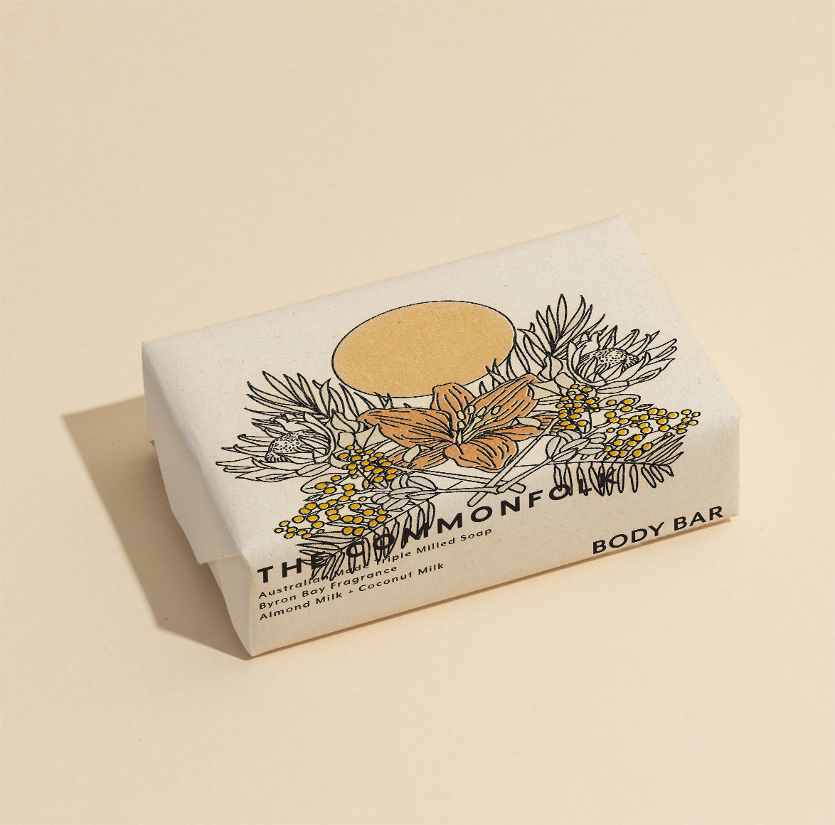 The Commonfolk 200g body bar soap with a floral design on the beige color wrapping.