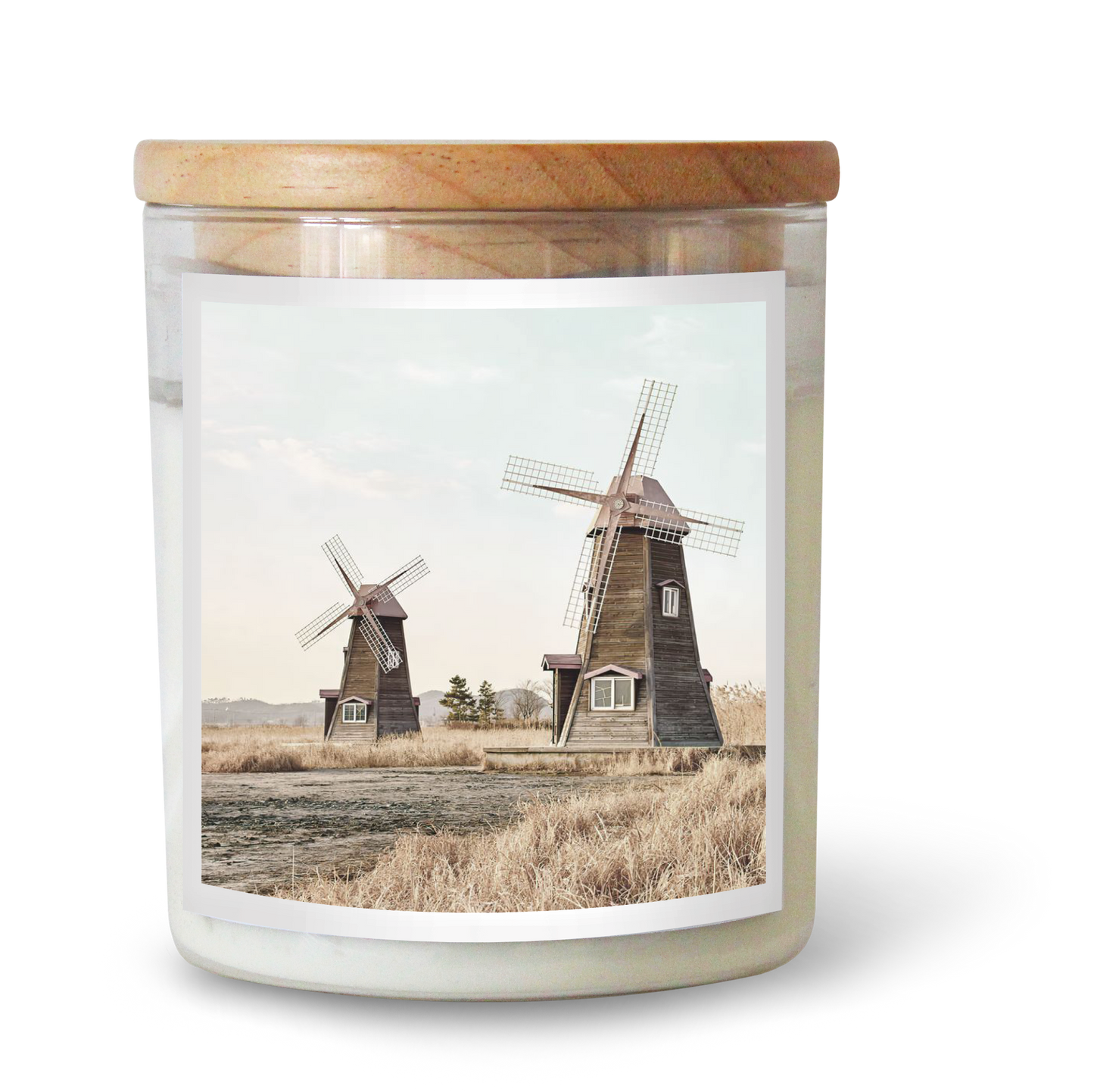 The Commonfolk scented candle features a label with two windmills in a countryside setting.