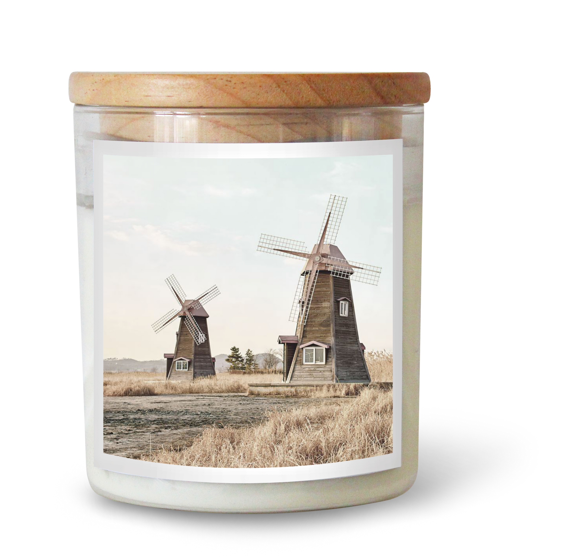 The Commonfolk scented candle features a label with two windmills in a countryside setting.