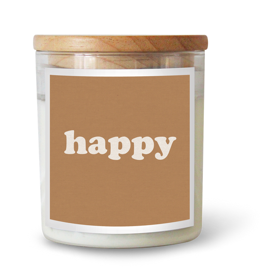 The Commonfolk scented candle has a beige label with the word 'happy' written on it, a wooden lid, and a white wax container.
