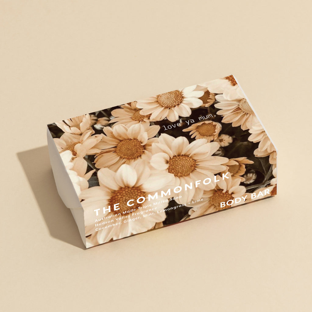 The Commonfolk 200g body bar soap with a floral design, labeled 'love ya mum' on the wrapping.
