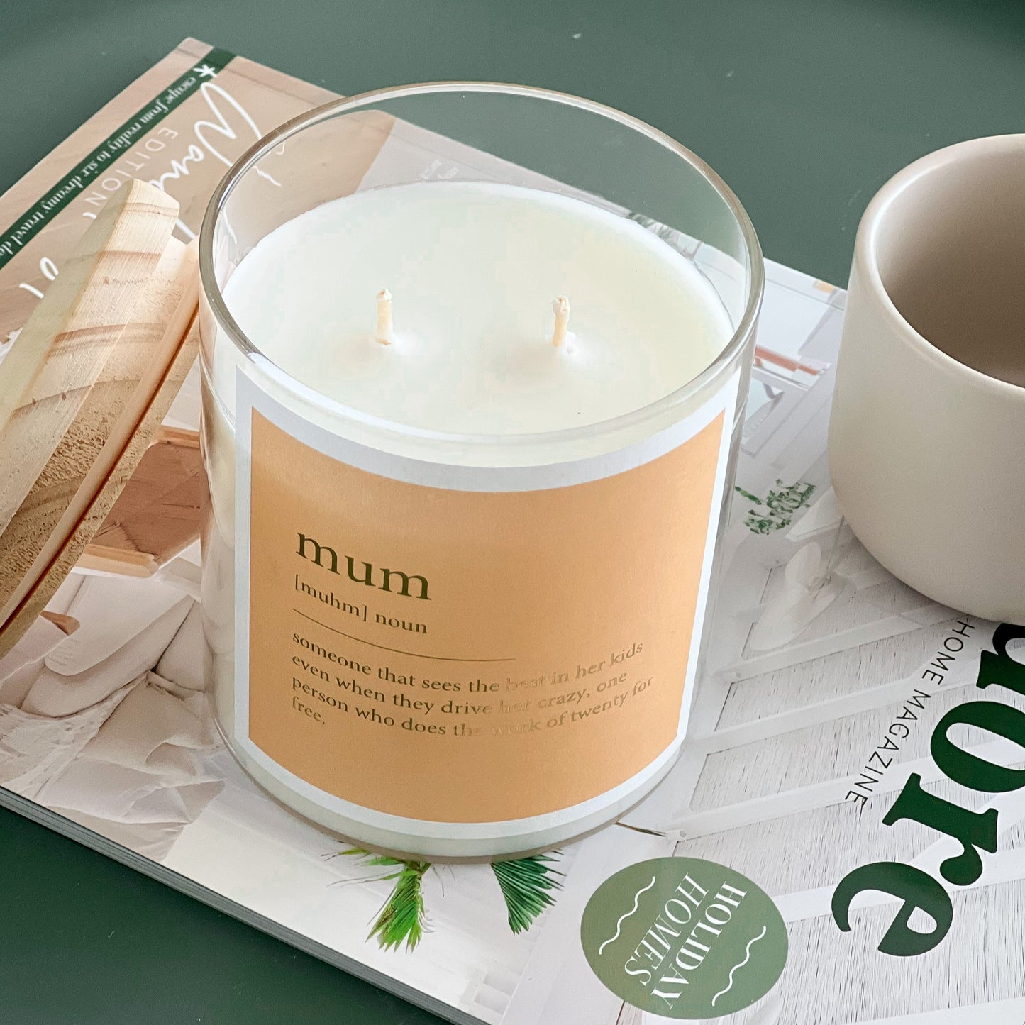 Mum candle mockup featuring a decorative candle with a label, set against a soft, neutral background.