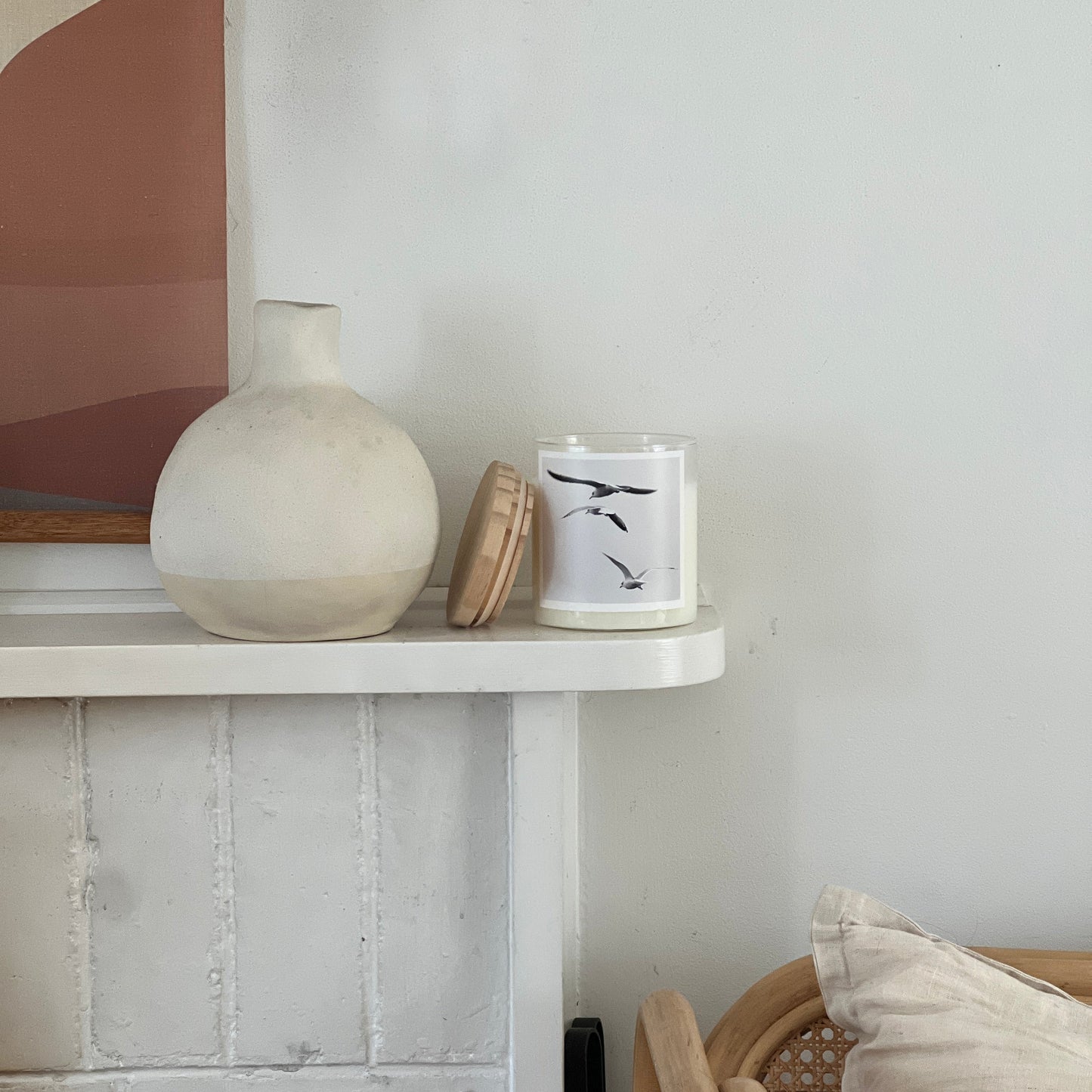 candle on fire place white walls vase 