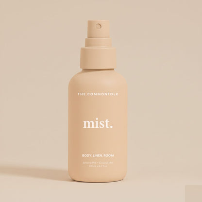 Nude spray bottle labeled 'mist' by 'The Commonfolk' on a beige background
