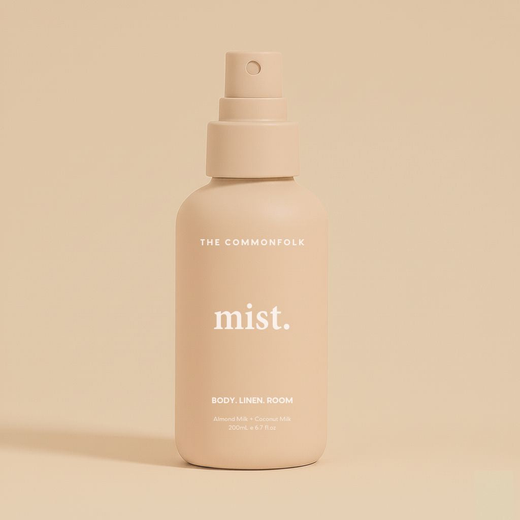 Nude mist spray bottle labeled 'mist' by 'The Commonfolk' on a beige background