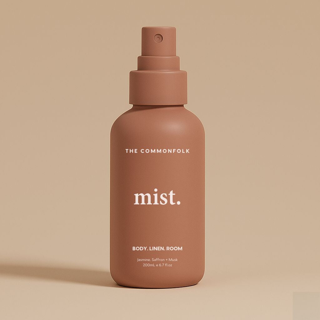 Rose Pink spray bottle labeled 'mist' by 'The Commonfolk' on a beige background