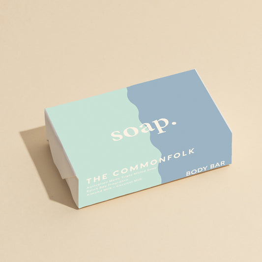 The Commonfolk 200g body bar soap comes in packaging that has a blue and white color scheme, with the text 'soap' printed on it.