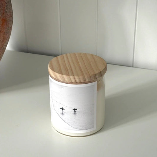 White jar with a wooden lid on a white surface