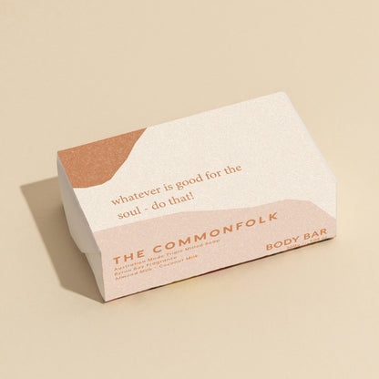 The Commonfolk 200g body bar soap has the text 'whatever is good for the soul - do that!' on the top. The packaging is in white with a beige section.