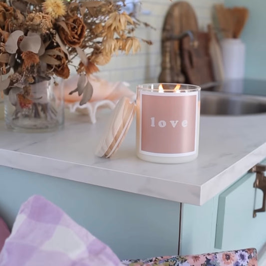 A candle placed on a kitchen counter, adding a warm ambiance to the space.